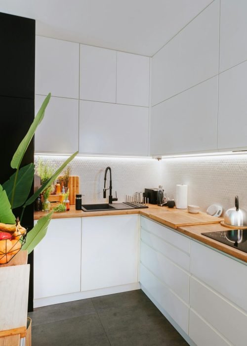 Home Sleek kitchen featuring smart tech and minimalist design, perfect for modern homes.