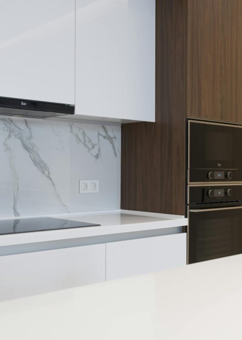 Home Contemporary clean kitchen with sleek appliances and wooden cabinetry, perfect for a new home.