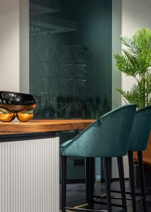 Home Elegant modern kitchen with sleek bar stools and contemporary decor.